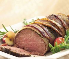Beef fillet wrapped with bacon and herbs
